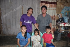 Cristina's husband and three children insider their home in Dao, Capiz.