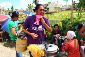 Cristina Bendoy of Brgy. Manhoy in Dao, Capiz sells foodstuff during the Pantawid Pamilya payout. 