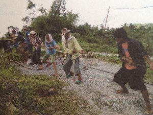 Typhoon-affected families helping in the repair of hanging bridge in Barangay Bayan, Passi City as part of the implementation of the Cash-for-Work Program.