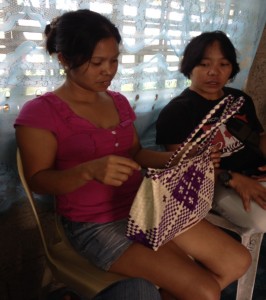 Jenaline shows off the bag that she made out of buri leaves while her aunt, Nelma Antipatia, who was instrumental in finding her through Listahanan, looks on.