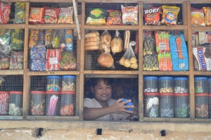 Lerma Hidayawan of Brgy. Vista Alegre, Bacolod City attends to her sari-sari store.