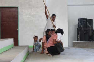 VILLAGERS portray during the MIBF that they need to cross the river before they can avail of health services  