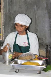 The processing of raw ginger and turmeric into tea entails patience and a lot of hardwork. In this photo, Gloria pounds the raw materials using a ceramic pulverizer. 