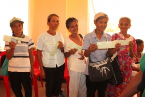 A group of senior citizens receive their P30,000 checks