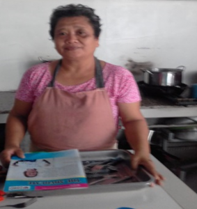 Caption: Fifty-year-old Mylieh Solidio Centina, a beneficiary of DSWD’s Sustainable Livelihood Program, now has a permanent job as a cook